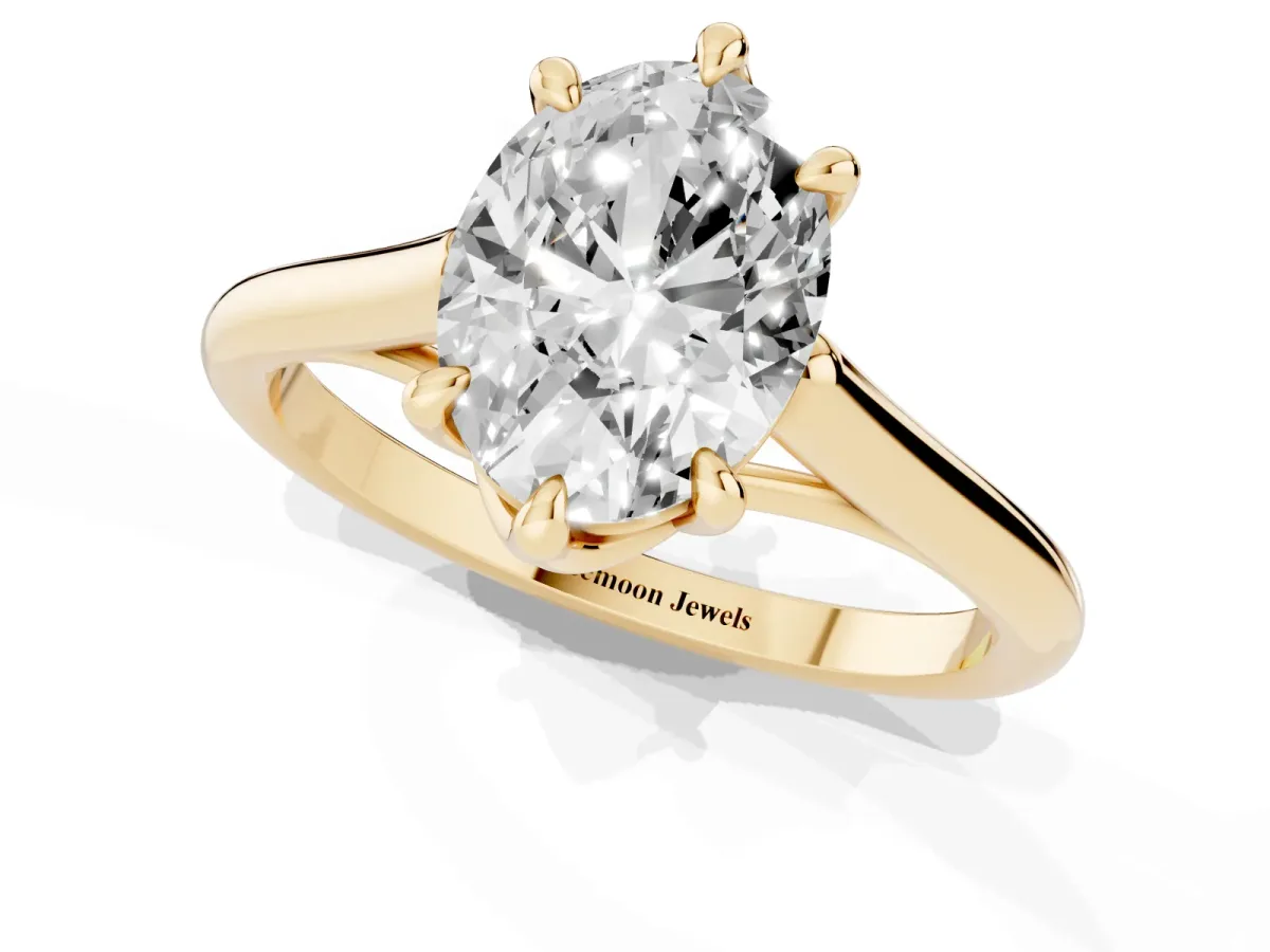 Oval Cut Solitaire Engagement Ring with Six-Prong Setting and Classic Band Yellow gold