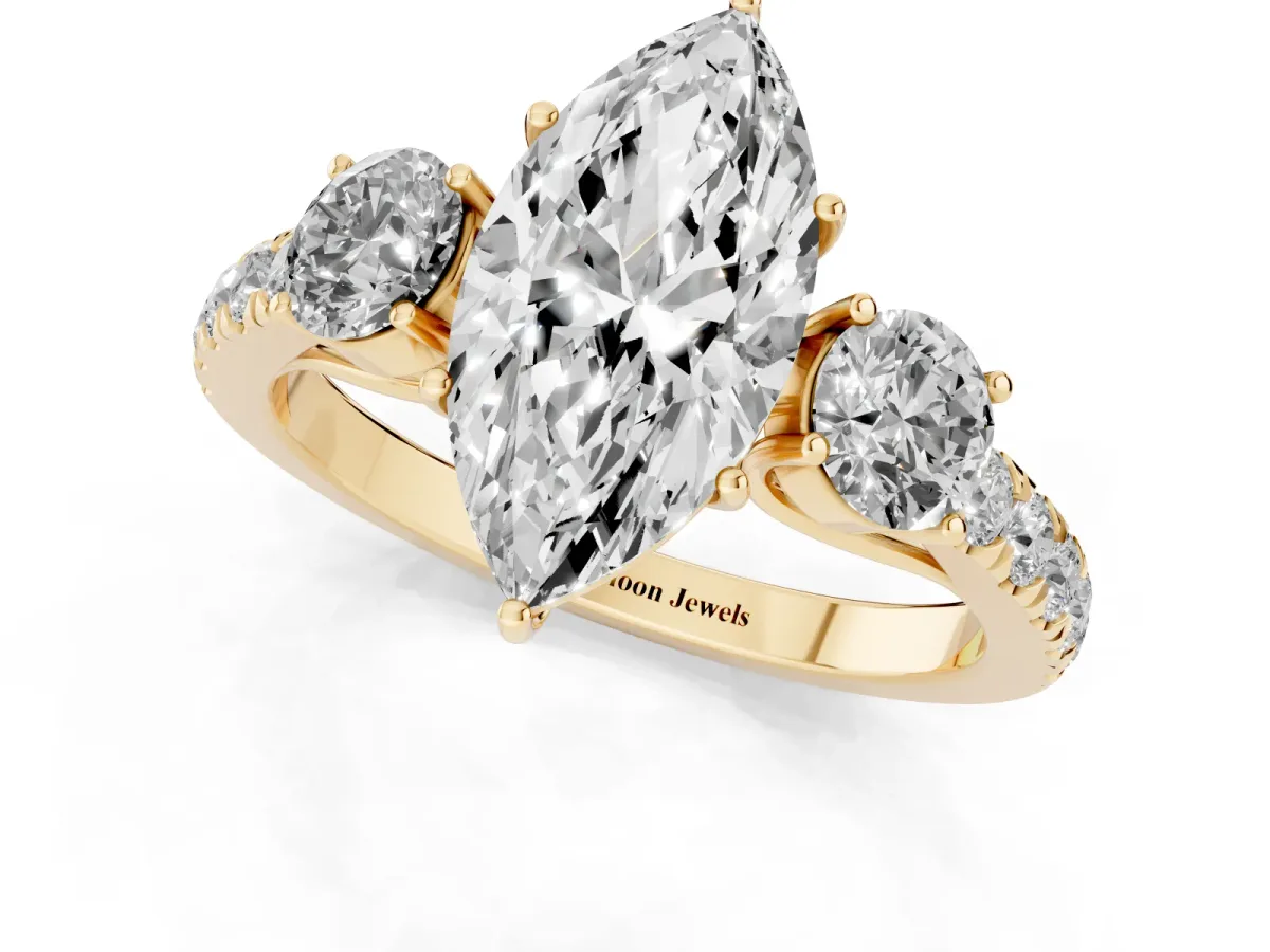 Marquise Cut Cut Diamond Three-Stone Ring with Round Side Stones and Pavé Band Yellow gold