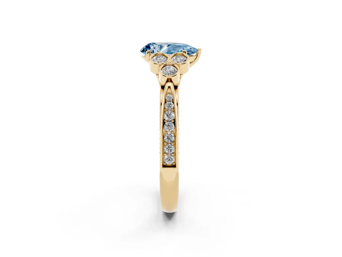 Fancy Blue Pear Cut Cut Diamond Engagement Ring with Bezel Set Round Side Stones and Prong Setting Yellow gold
