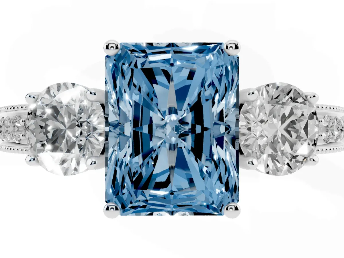 Fancy Blue Radiant Cut Three-Stone Diamond Ring with Pavé Band and Four-Prong Setting Silver