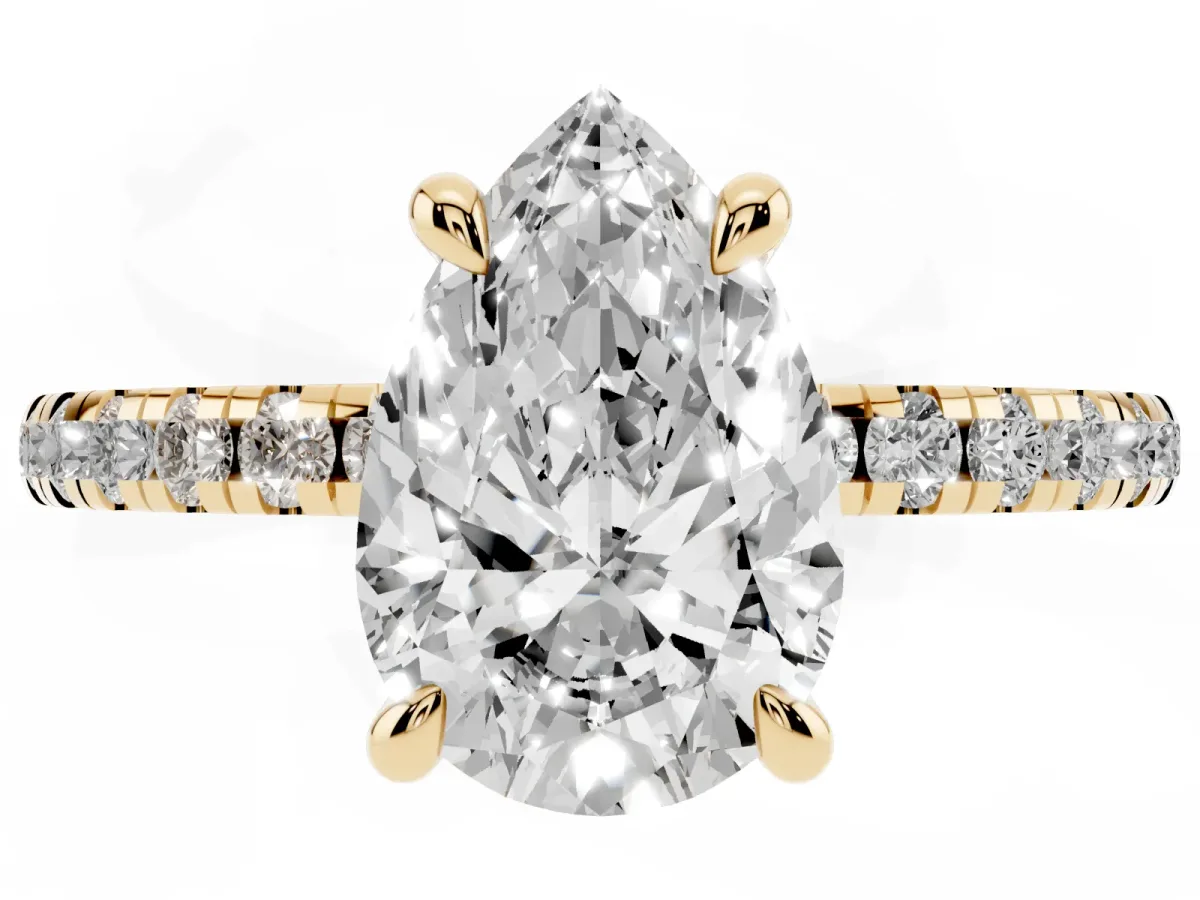 Pear Cut Diamond Brilliant Solitaire Ring with Pavé Band and Four-Prong Setting Yellow gold
