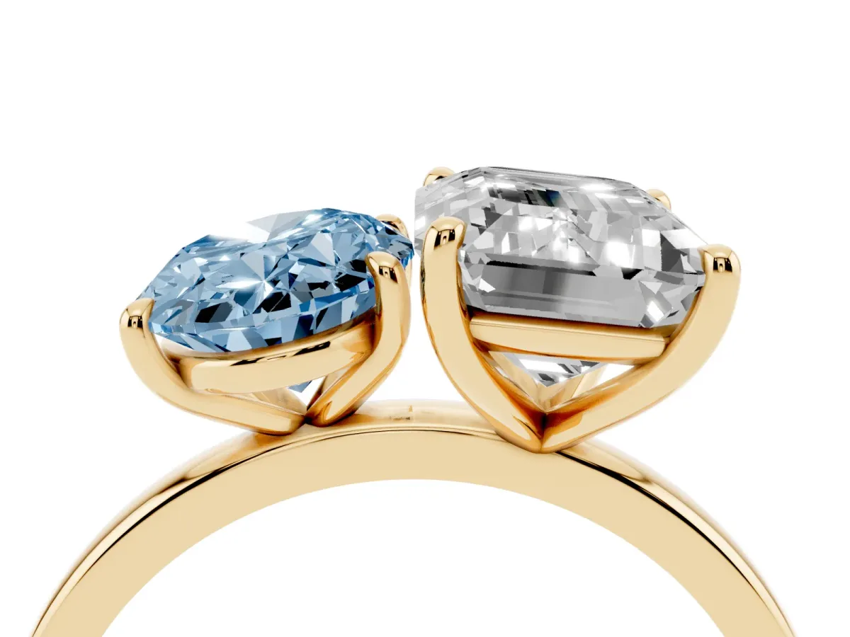 Fancy Blue Oval Cut and Emerald Cut Toi Moi Ring with Prong Setting Yellow gold