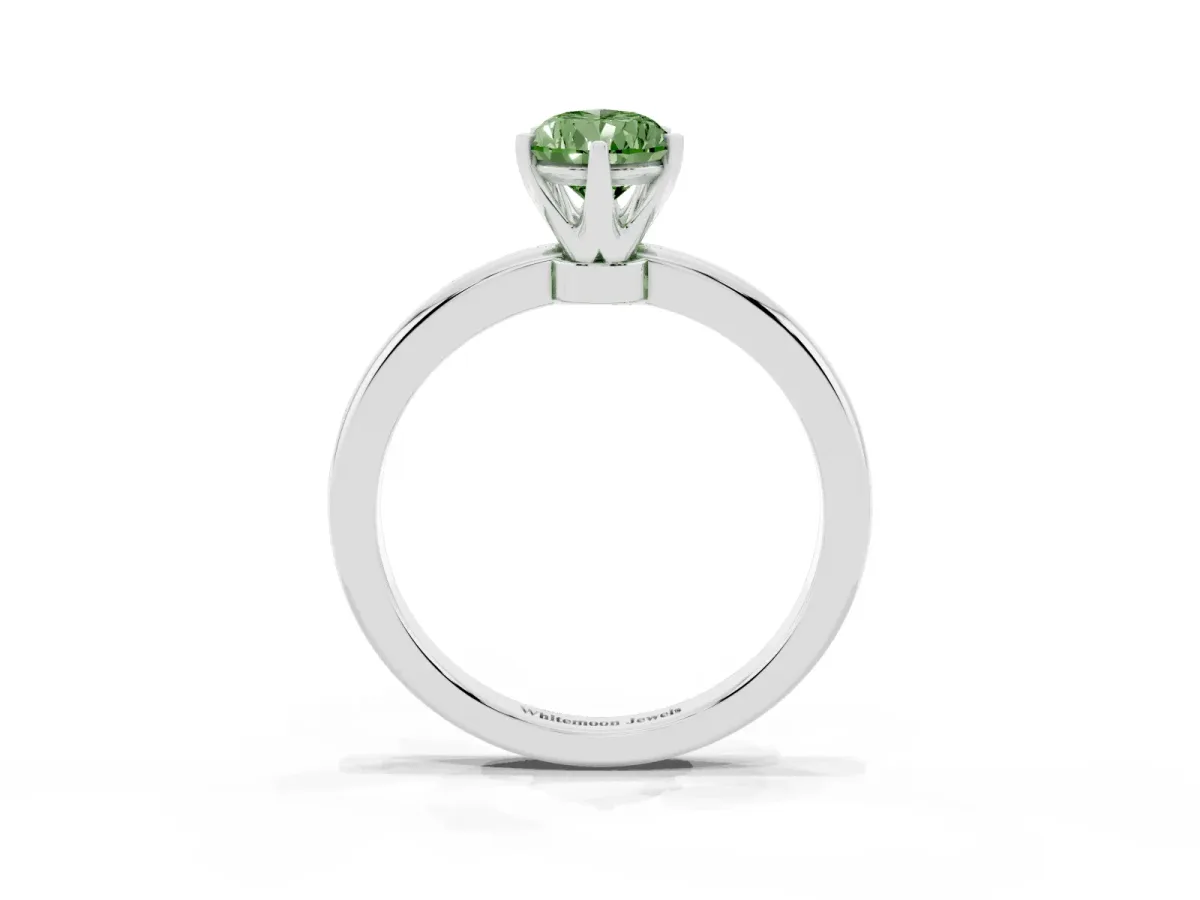 Fancy Green Pear Cut Solitaire Diamond Ring with Six-Prong Setting on a Classic Band Silver