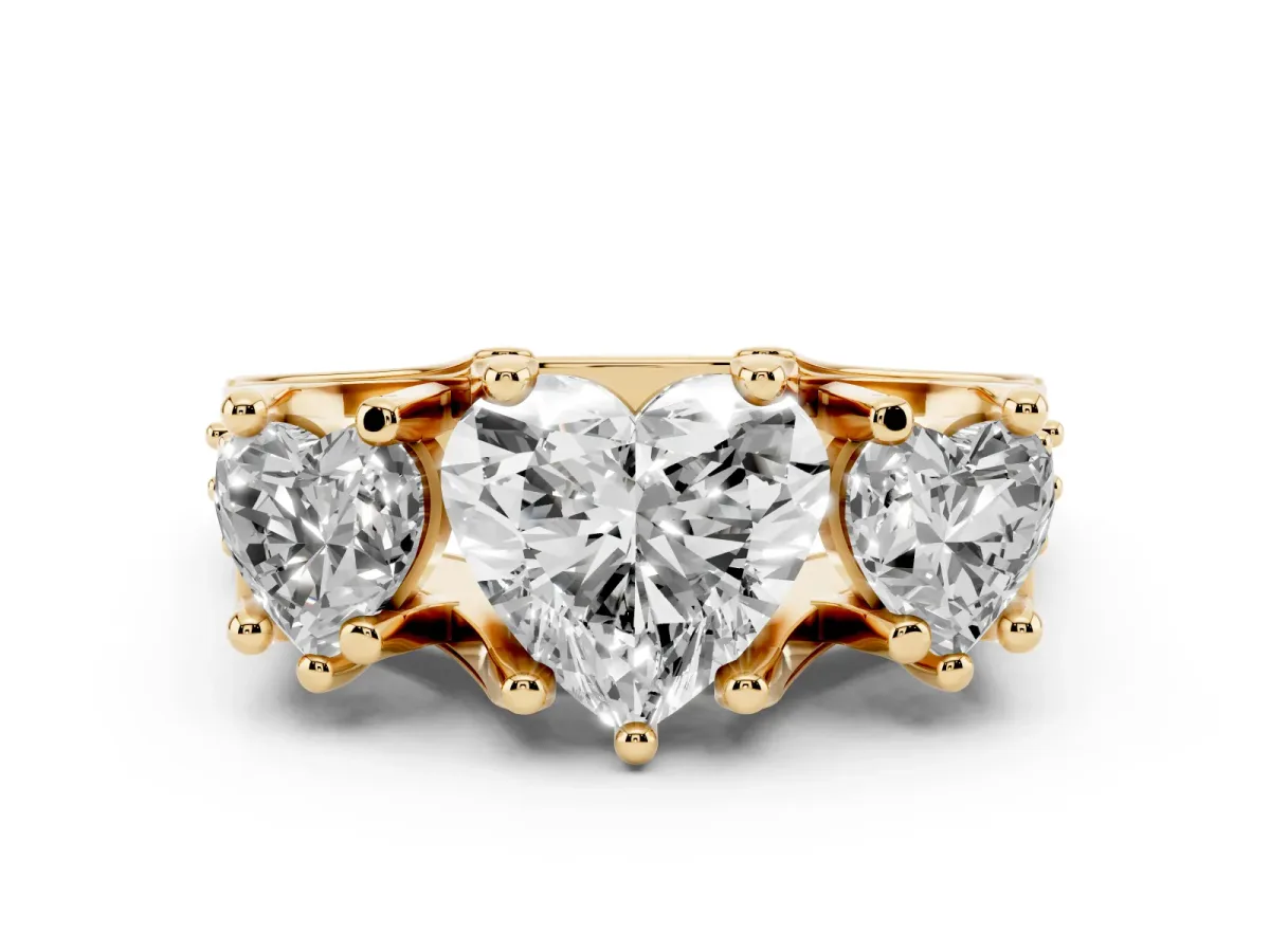 Heart Cut Diamond Three-Stone Ring with Channel Set Band and Four-Prong Setting Yellow gold