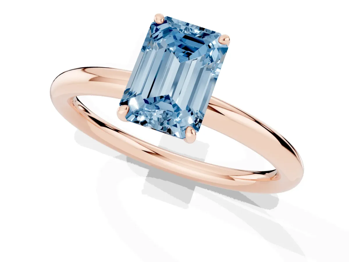 Fancy Blue Emerald Cut Solitaire Diamond Ring with Four-Prong Setting on a Plain Band Rose gold