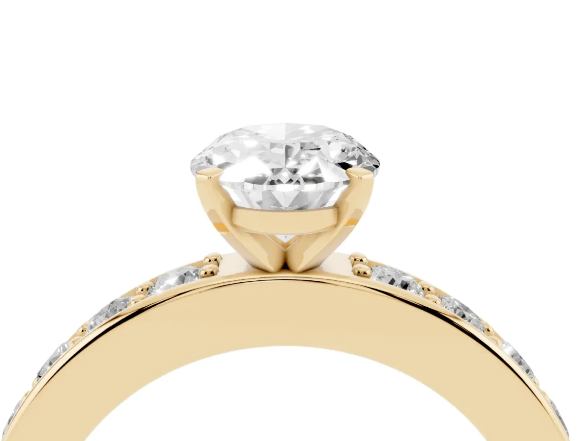 Oval Cut Diamond Engagement Ring with Channel Set Round Band and Prong Setting Yellow gold