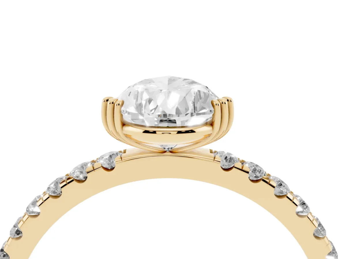 Pear Cut Brilliant Solitaire with Pavé Band and Claw Prong Setting Yellow gold