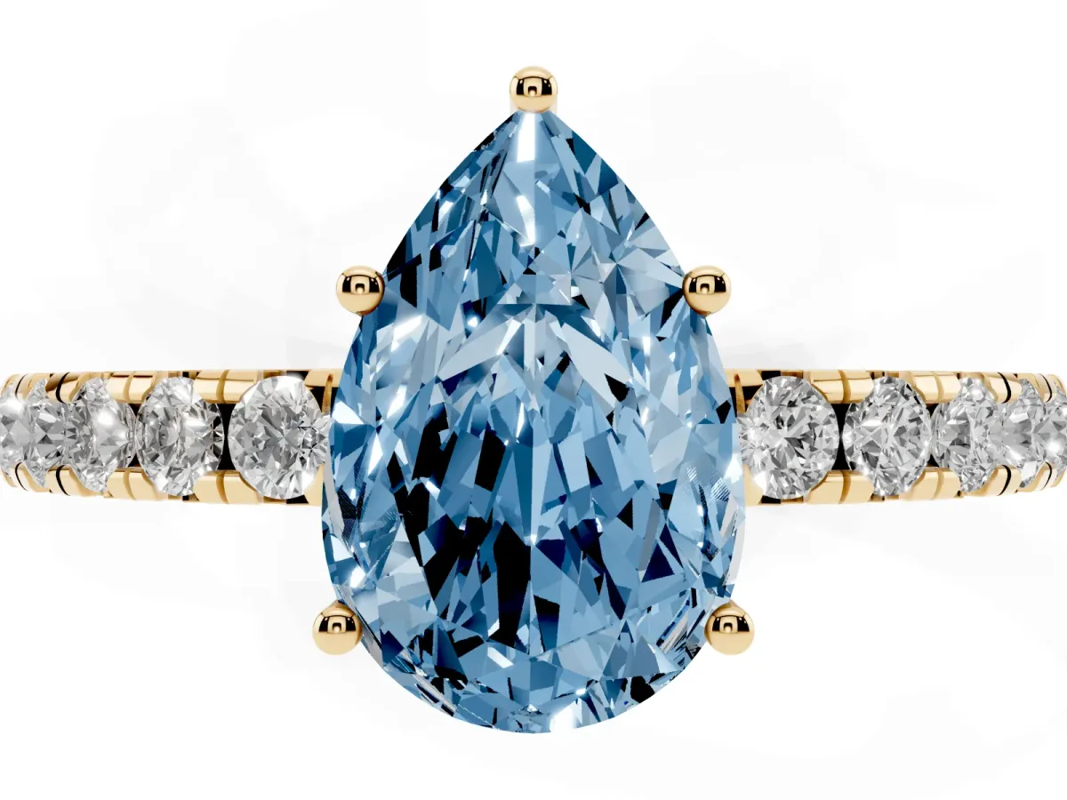 Fancy Blue Pear Cut Diamond Pavé Solitaire Engagement Ring with Four-Prong Setting Yellow gold