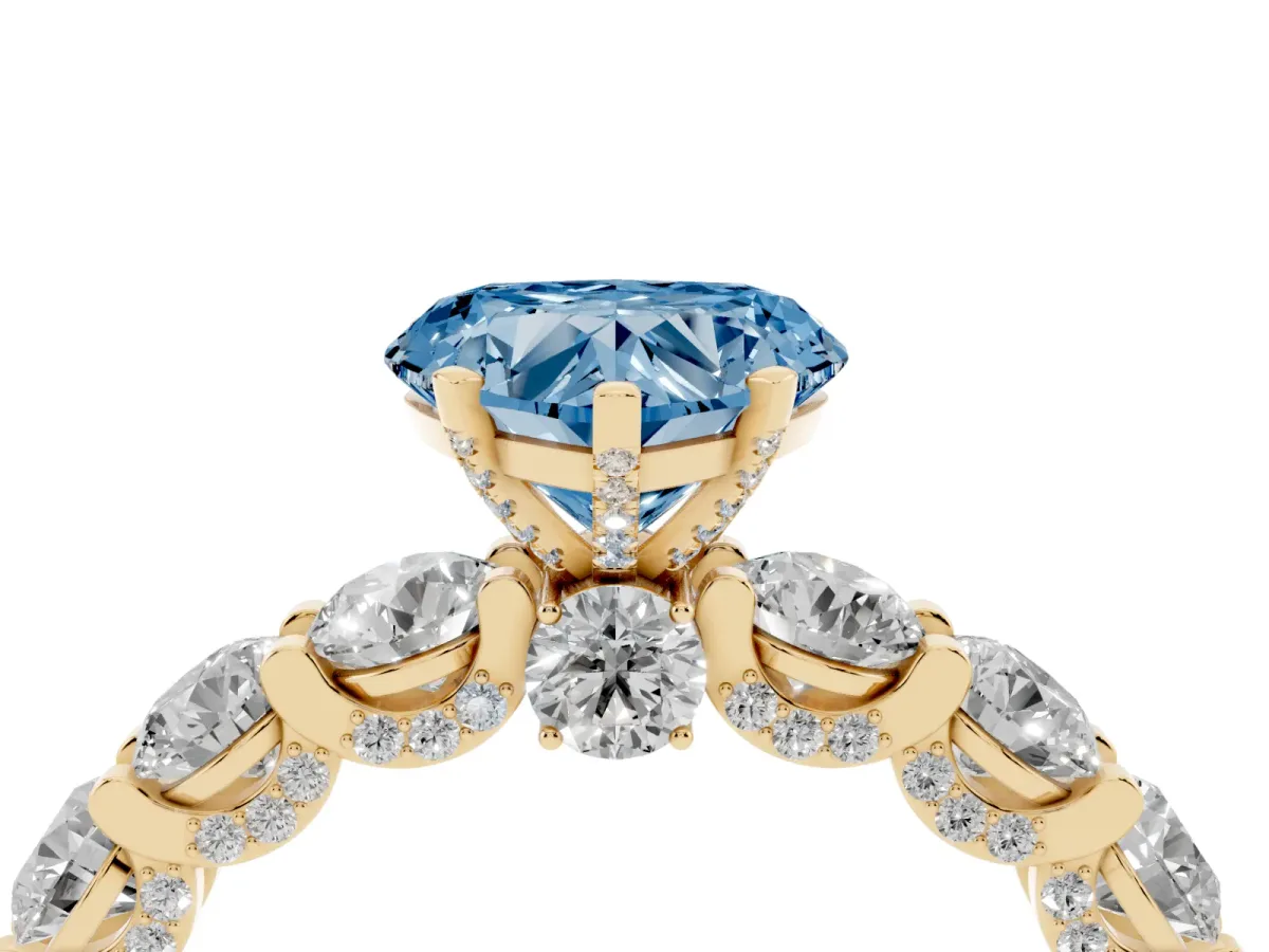 Fancy Blue Heart Cut Diamond Side Stone Engagement Ring with Four-Prong Setting Yellow gold