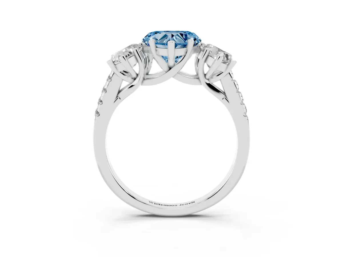 Fancy Blue Three-Stone Heart Cut Diamond Ring with Round Pavé Band and Prong Setting Silver