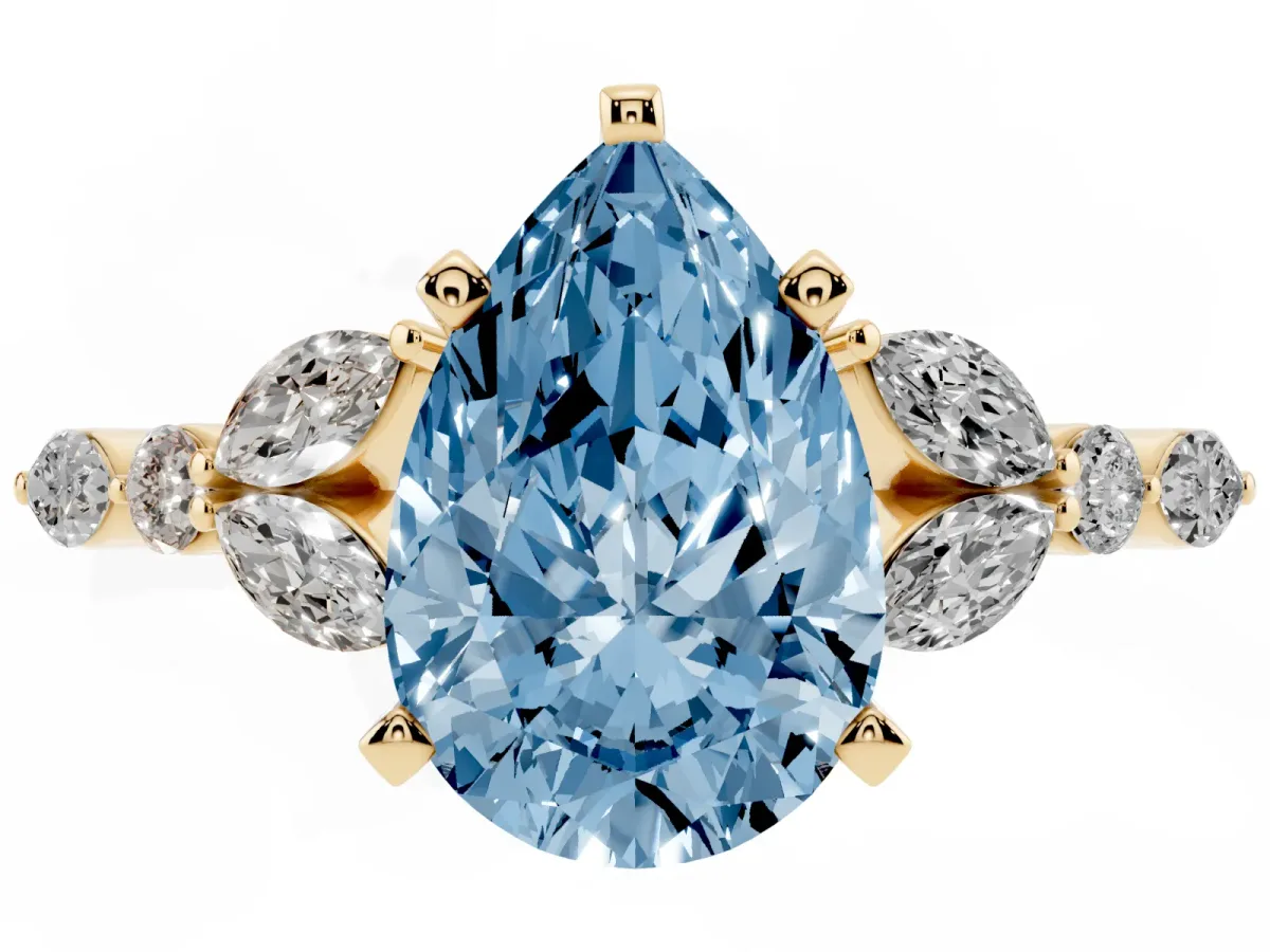 Fancy Blue Pear Cut Diamond Solitaire Ring with Side Stones and Four-Prong Setting Yellow gold