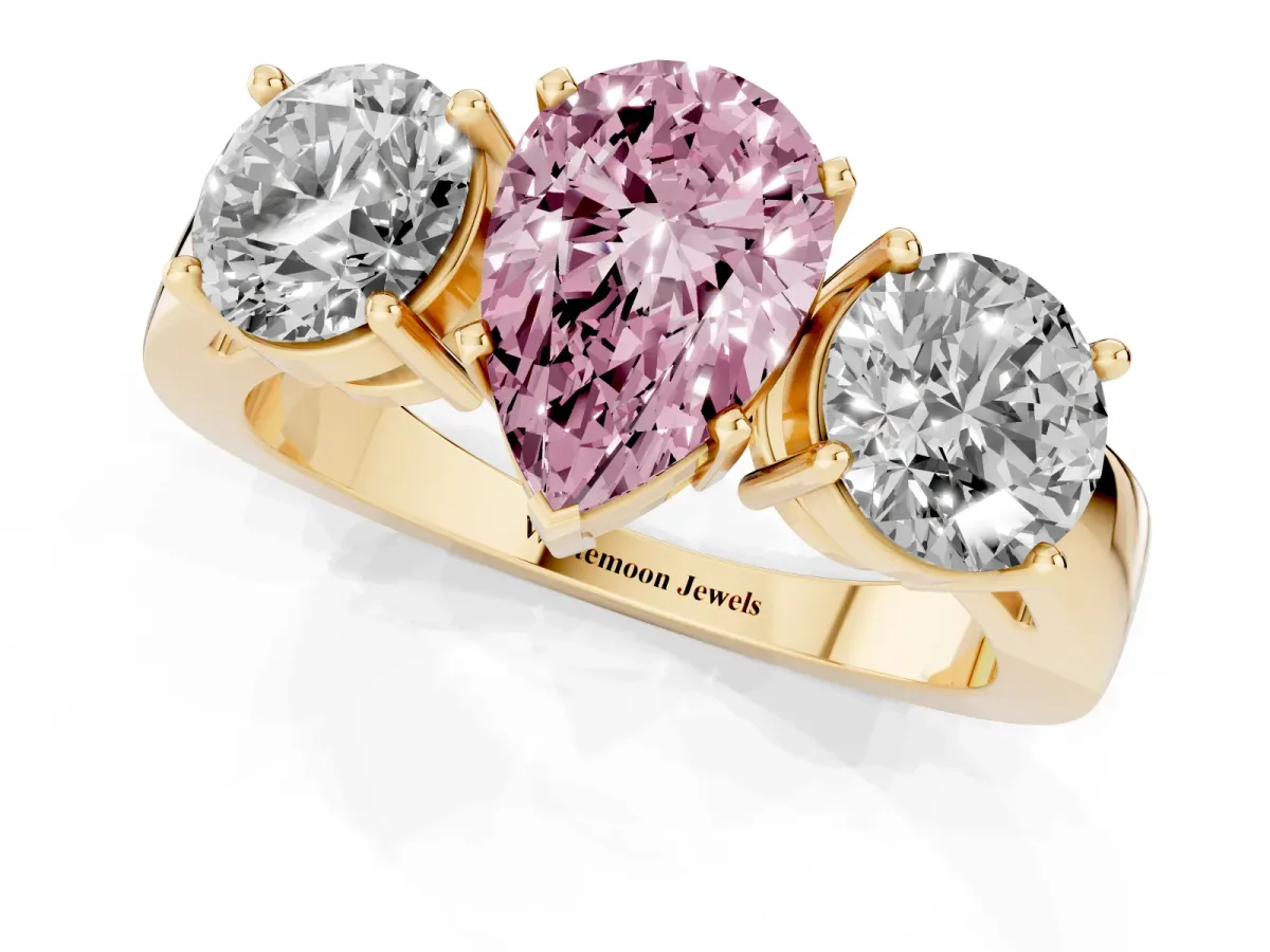 Fancy Pink Three-Stone Pear Cut Diamond Ring with Round Side Stones, Classic Band, and Four-Prong Setting Yellow gold