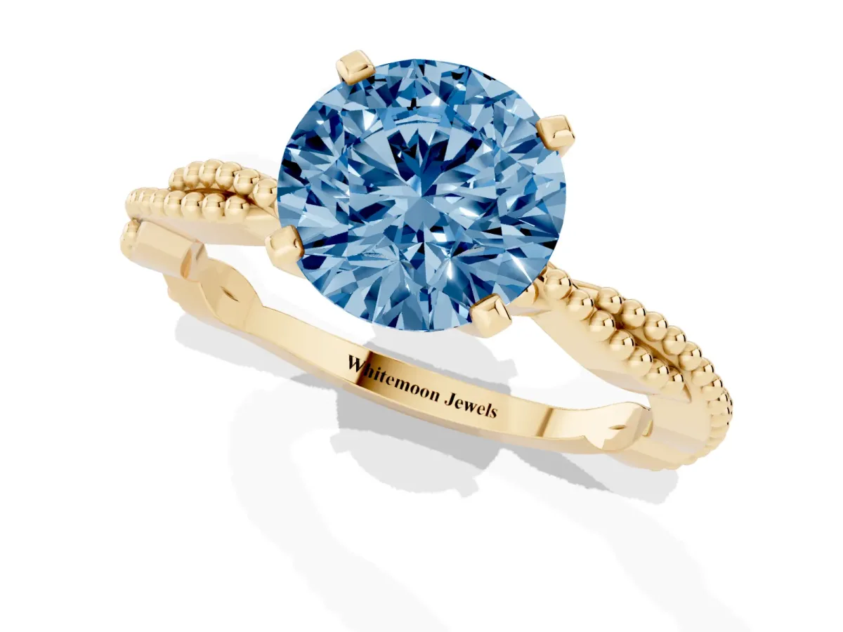 Fancy Blue Round Cut Solitaire Twisted Band with Bead Prong Setting Yellow gold