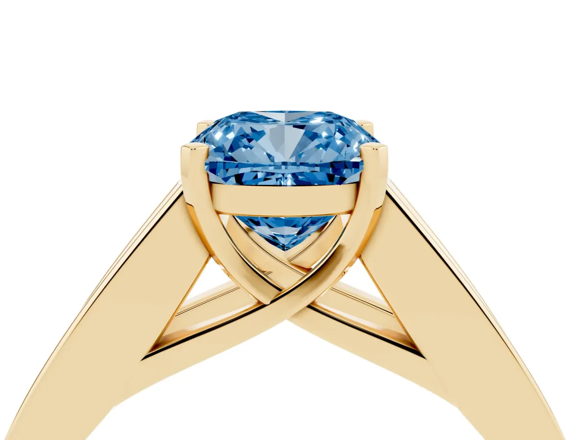 Fancy Blue Cushion Cut Cut Channel Set Solitaire Ring with Four-Prong Setting Yellow gold