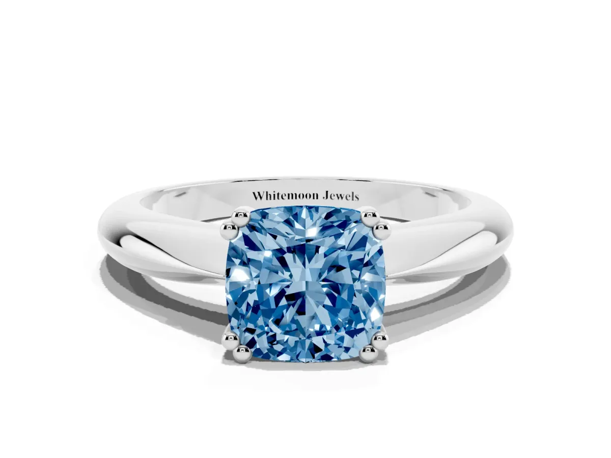 Fancy Blue Cushion Cut Cut Solitaire Engagement Ring with Tapered Band and Four-Prong Setting Platinum