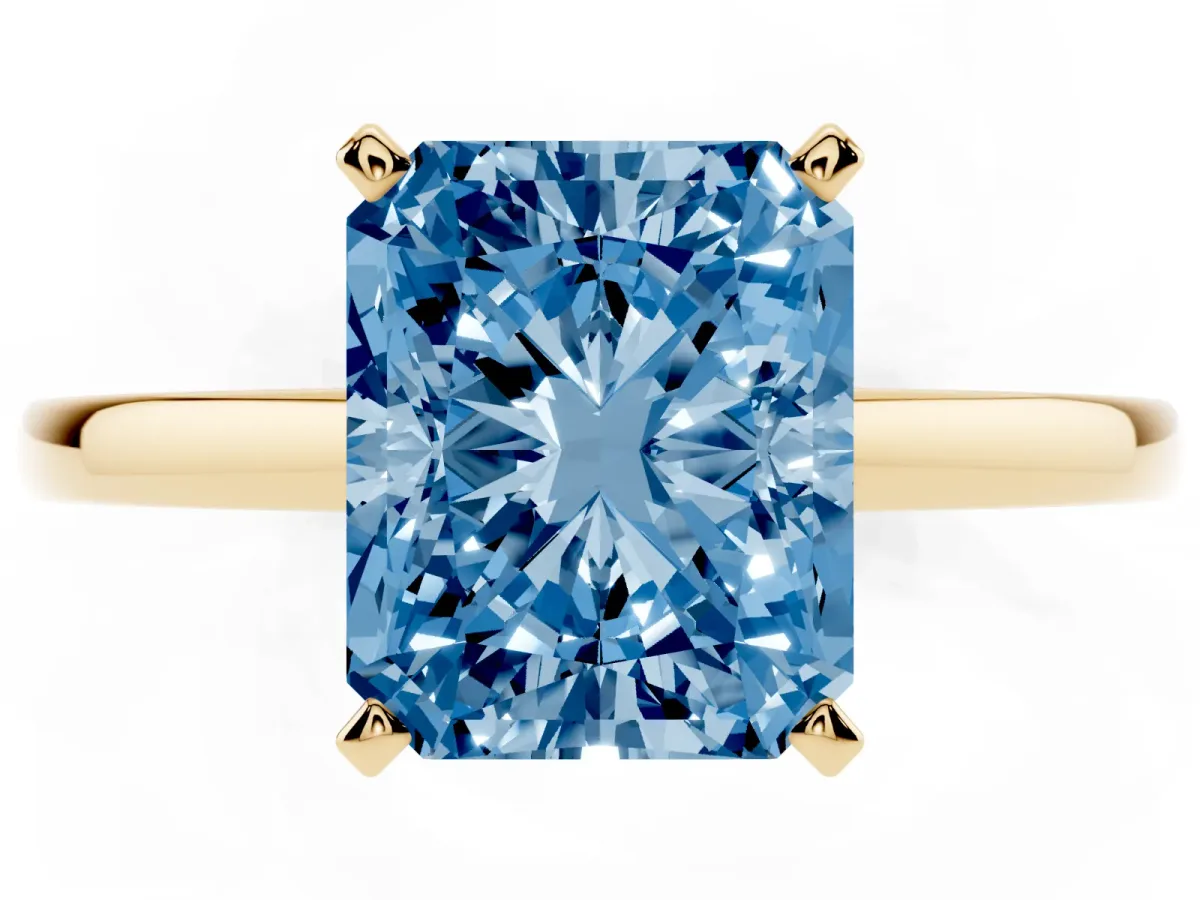 Fancy Blue Radiant Cut Solitaire Diamond Engagement Ring with Four-Prong Setting on a Classic Band Yellow gold