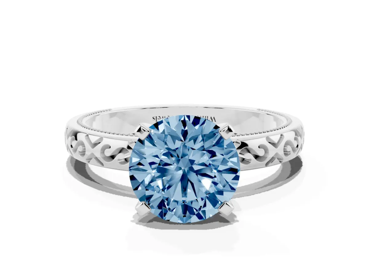 Fancy Blue Round Cut Solitaire Engagement Ring with Scrollwork Band and Four-Prong Setting Silver