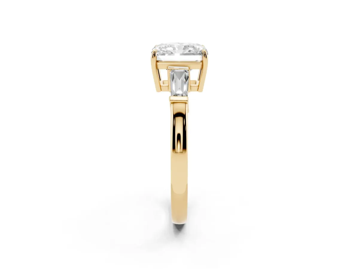 Radiant Cut Diamond Three-Stone Ring with Tapered Baguette Side Stones and Prong Setting Yellow gold