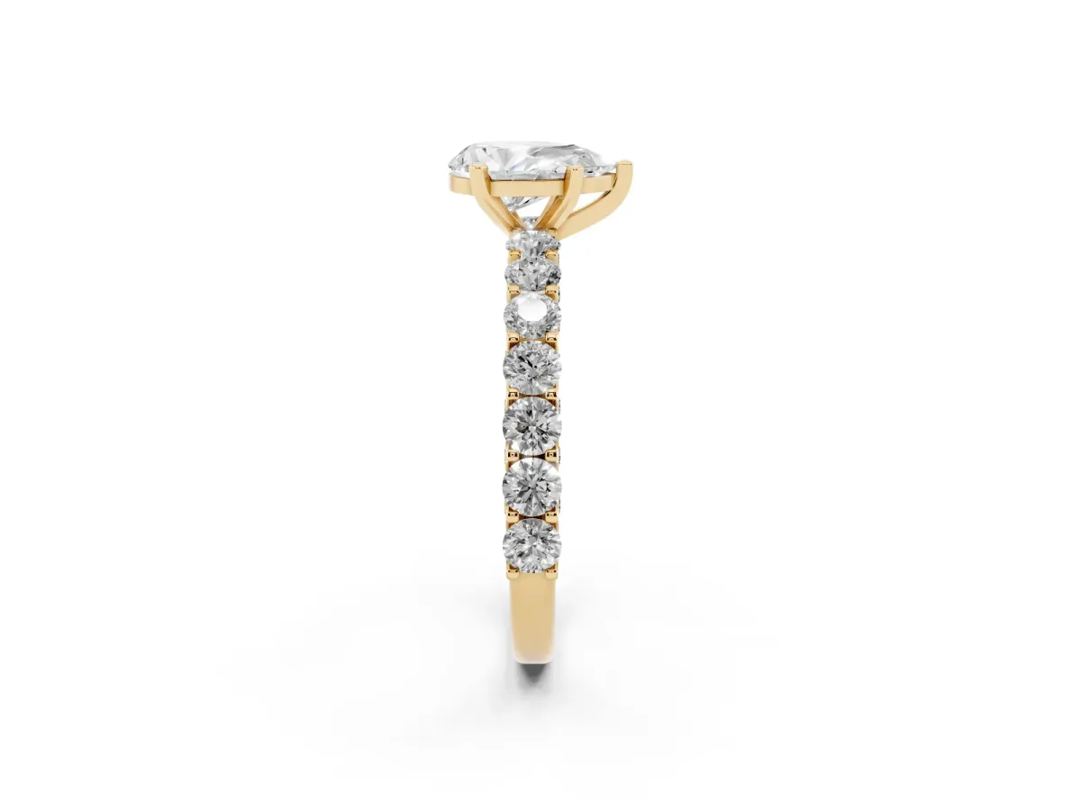 Pear Cut Diamond Solitaire Ring with Shared Prong Pavé Band and Four-Prong Setting Yellow gold