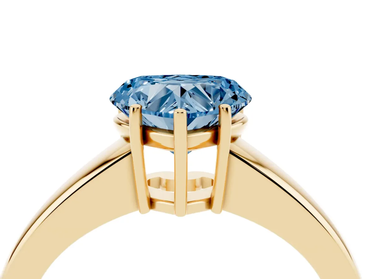 Fancy Blue Heart Cut Solitaire Diamond Ring with Tapered Band and Four-Prong Setting Yellow gold