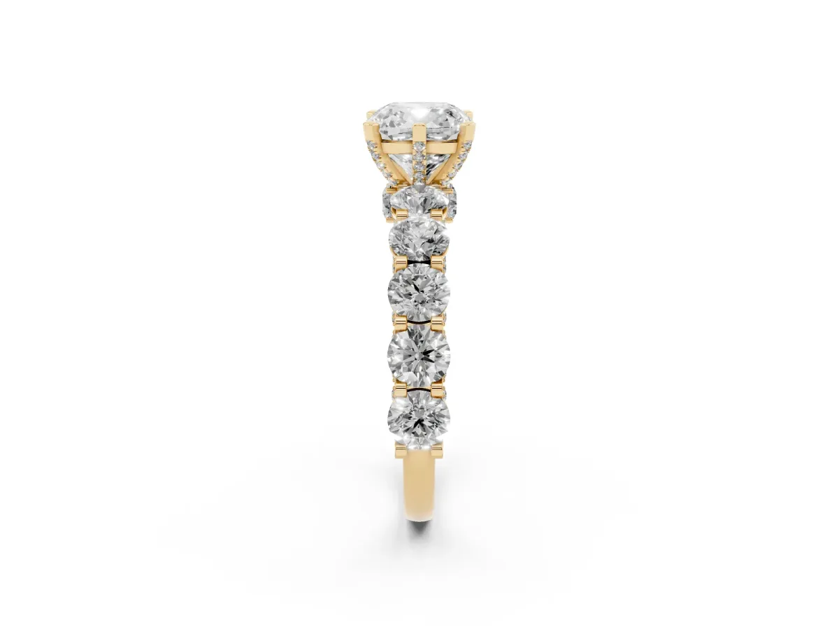 Cushion Cut Diamond Side Stone Engagement Ring with Four-Prong Setting Yellow gold