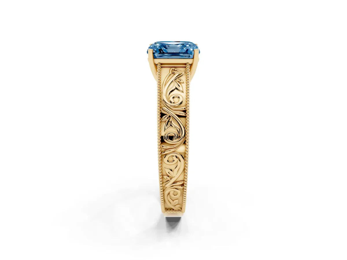 Fancy Blue Asscher Cut Diamond Solitaire Ring with Engraved Band and Four-Prong Setting Yellow gold