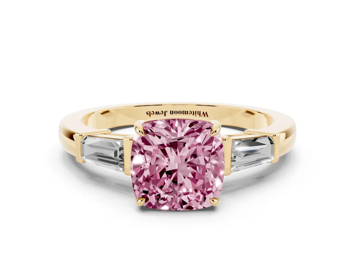 Fancy Pink Cushion Cut Diamond Three-Stone Ring with Tapered Baguette Side Stones and Prong Setting Yellow gold