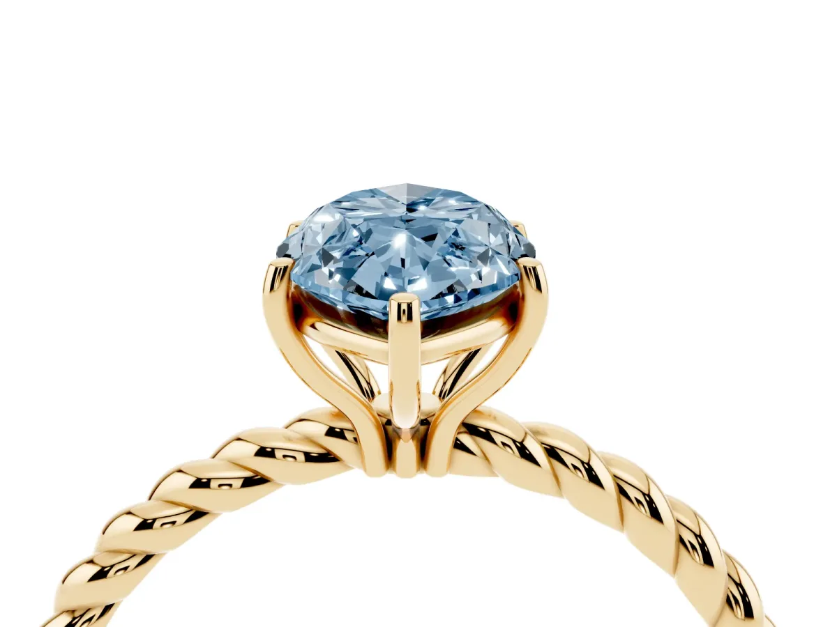 Fancy Blue Marquise Cut Solitaire Twist Band Ring with Four-Prong Setting Yellow gold