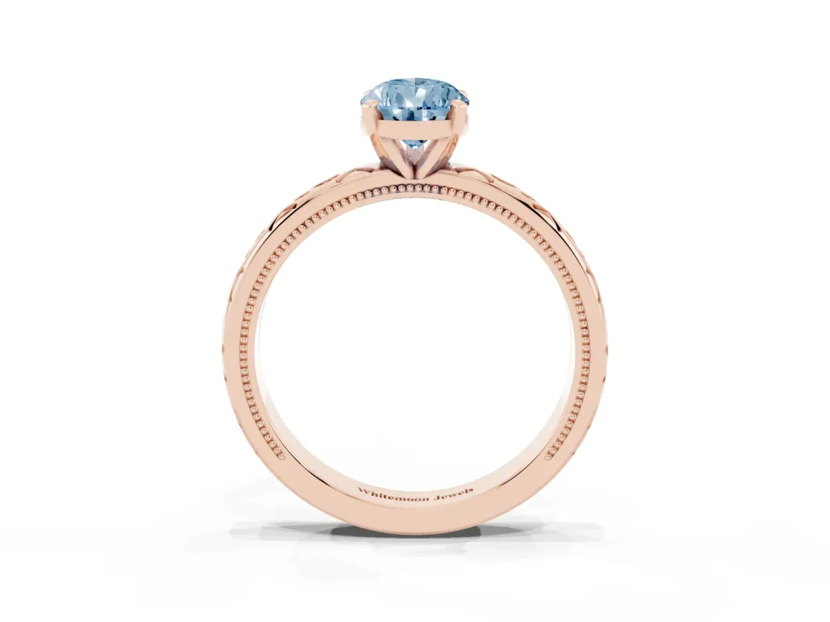 Fancy Blue Pear Cut Solitaire Engagement Ring with Scrollwork Band and Four-Prong Setting Rose gold
