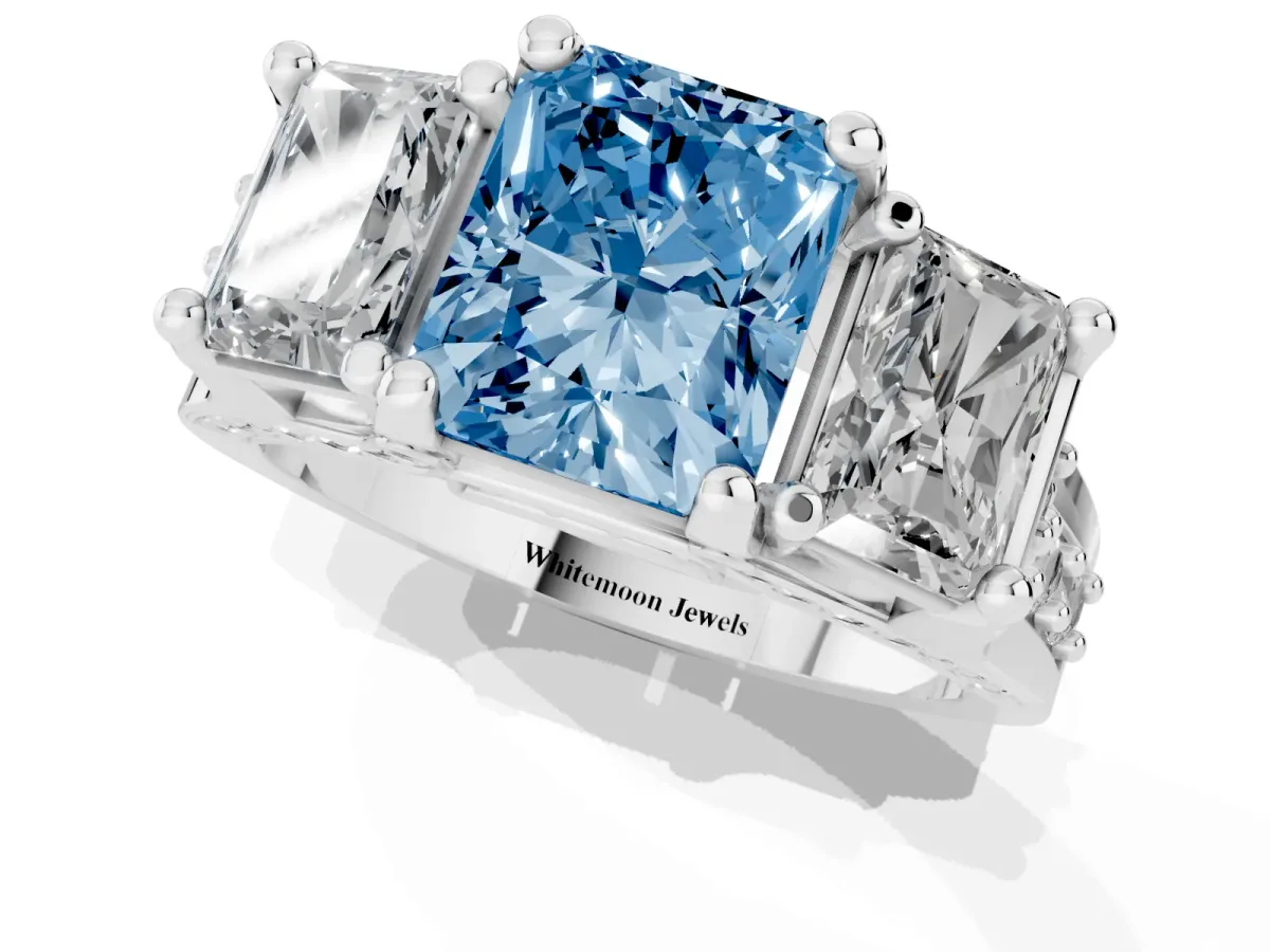 Fancy Blue Radiant Cut Diamond Three-Stone Ring with Channel Set Band and Four-Prong Setting Silver
