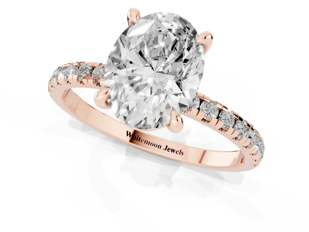 Oval Cut Diamond Brilliant Solitaire Ring with Pavé Band and Four-Prong Setting Rose gold