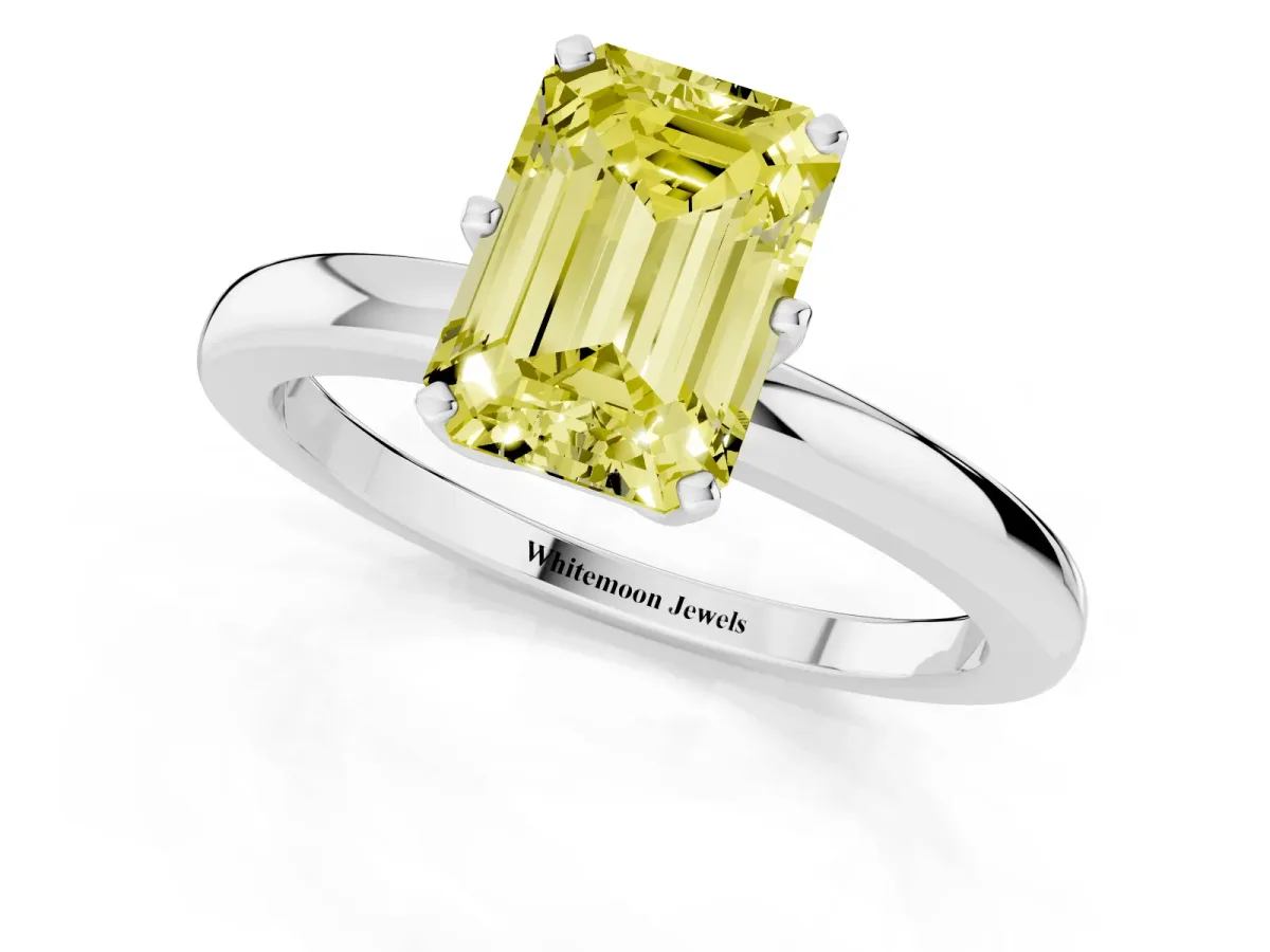 Fancy Yellow Emerald Cut Solitaire Diamond Ring with Six-Prong Setting on a Classic Band Platinum