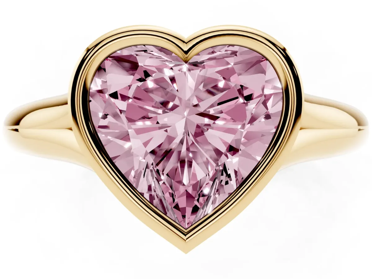 Fancy Pink Bezel Set Heart Cut Solitaire Diamond Ring with Smooth Band Yellow gold