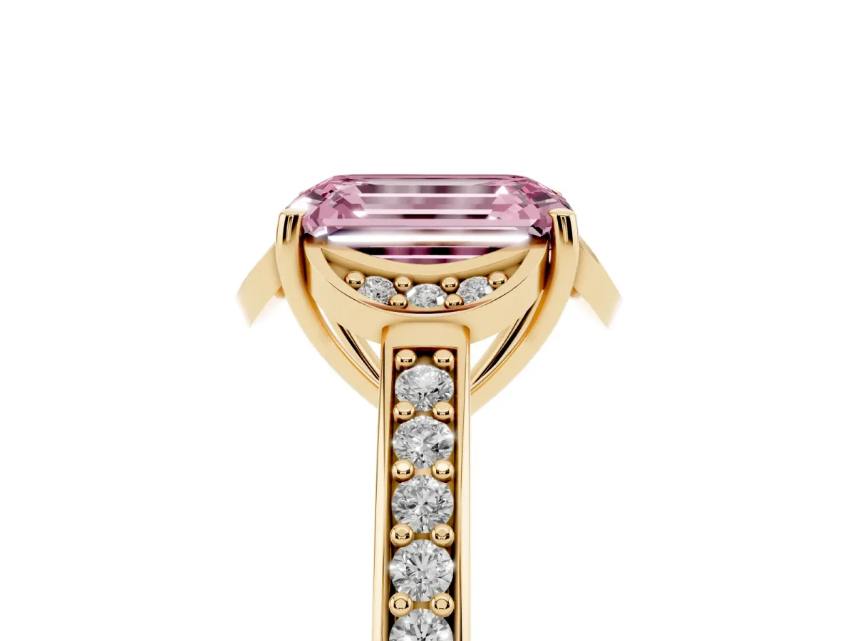 Fancy Pink Emerald Cut Cut Halo Diamond Ring with Channel Set Band and Four-Prong Setting Yellow gold
