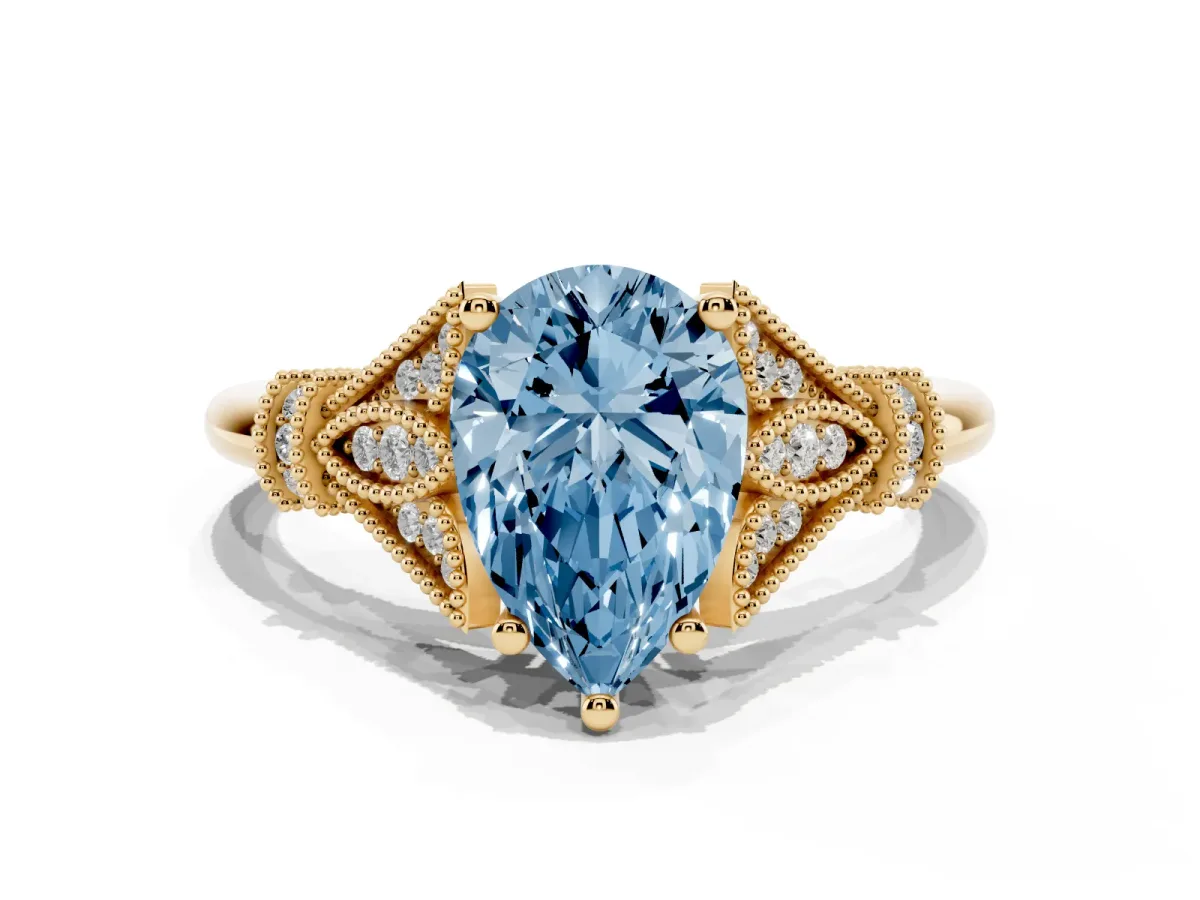 Fancy Blue Pear Cut Diamond Solitaire Ring with Floral Filigree and Pave Accents Yellow gold