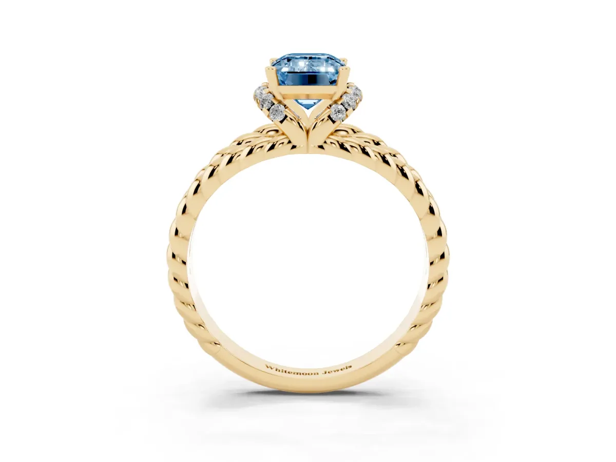 Fancy Blue Emerald Cut Halo Twisted Band Four-Prong Ring Yellow gold