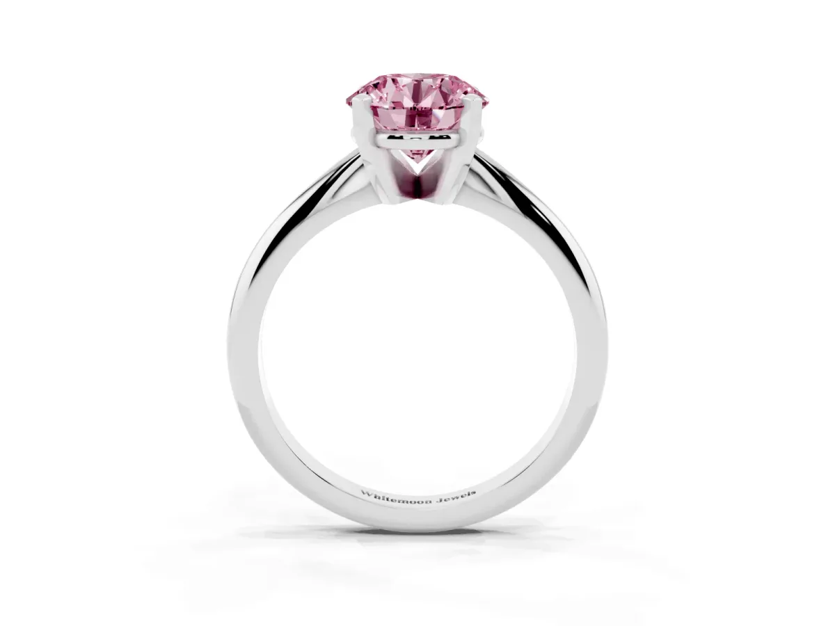 Fancy Pink Round Cut Cut Solitaire Ring with Four-Prong Setting on a Classic Band Silver