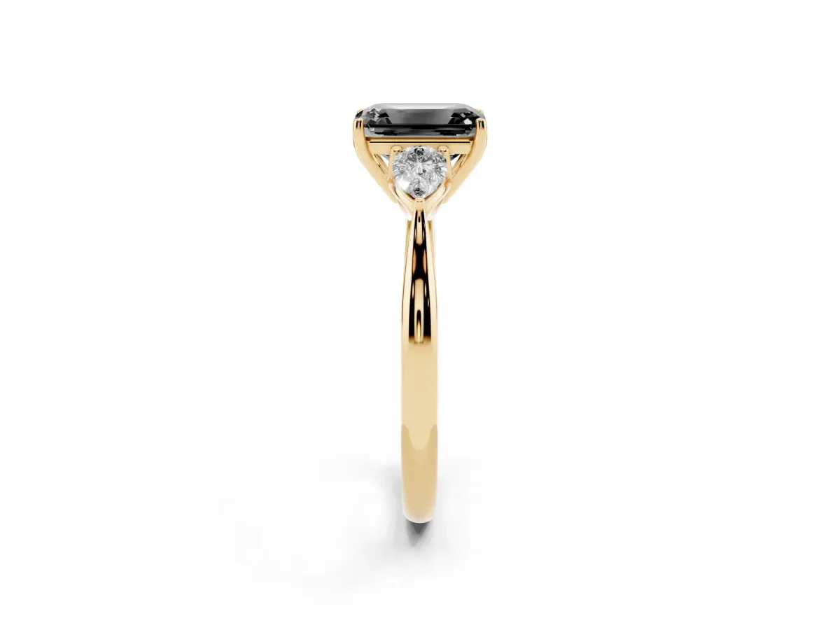 Fancy Black Emerald Cut Diamond Three-Stone Ring with Pear Side Stones and Prong Setting Yellow gold