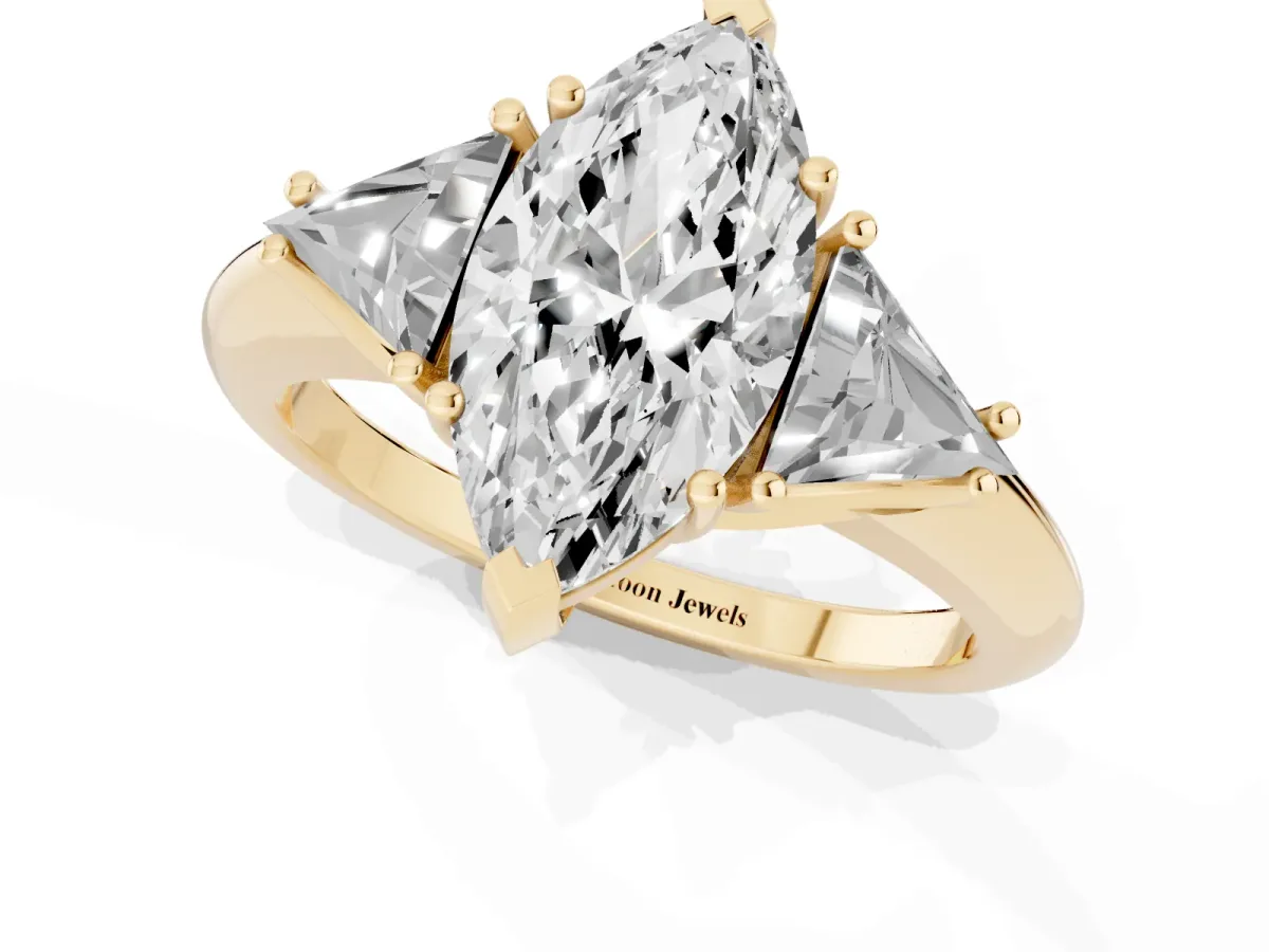 Three-Stone Marquise Cut Diamond Engagement Ring with Trillion Side Stones and Prong Setting Yellow gold
