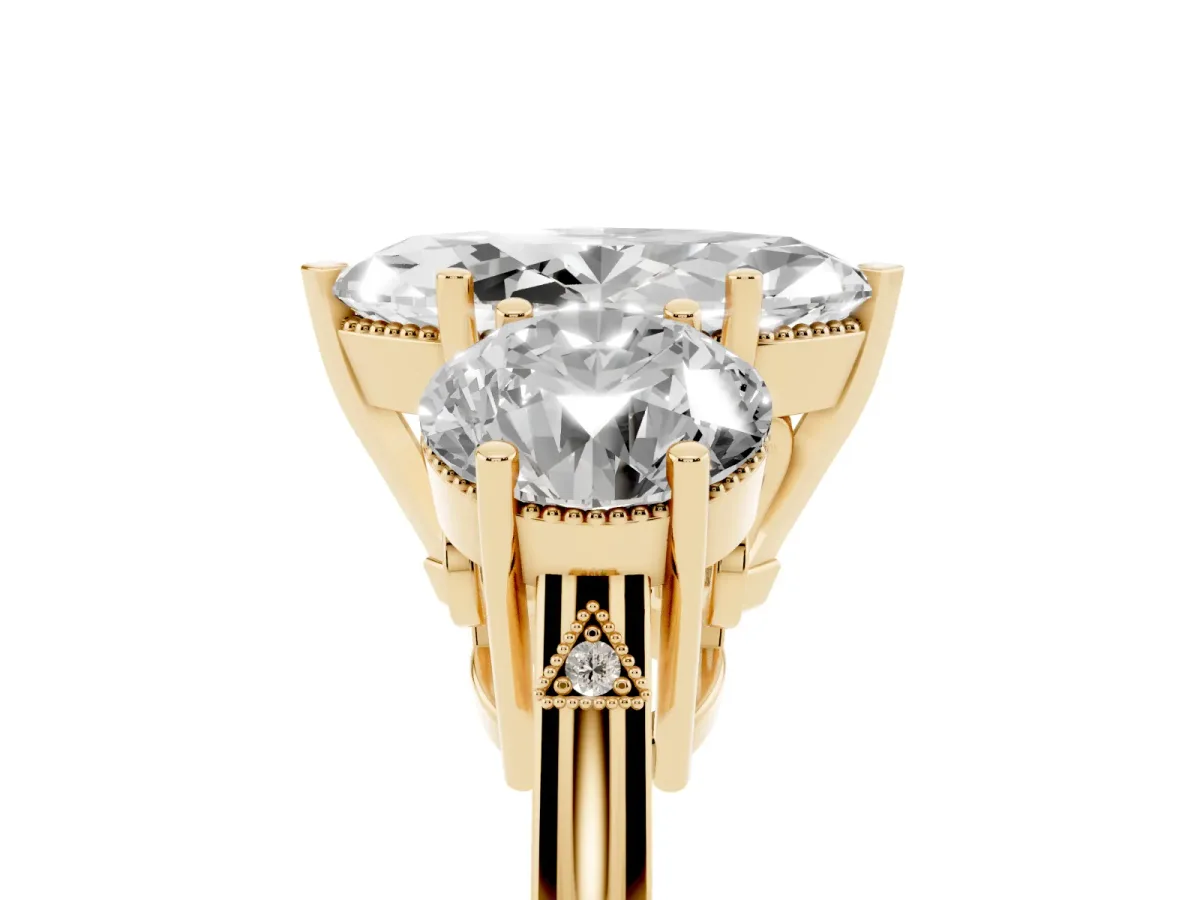 Three-Stone Marquise Cut Diamond Engagement Ring with Prong Setting on a Classic Band Yellow gold