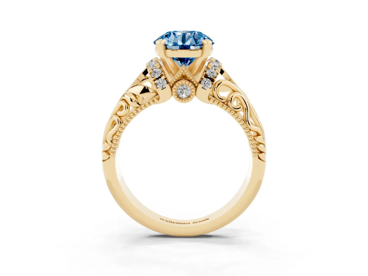 Fancy Blue Round Cut Solitaire Filigree Engagement Ring with Halo and Prong Setting Yellow gold