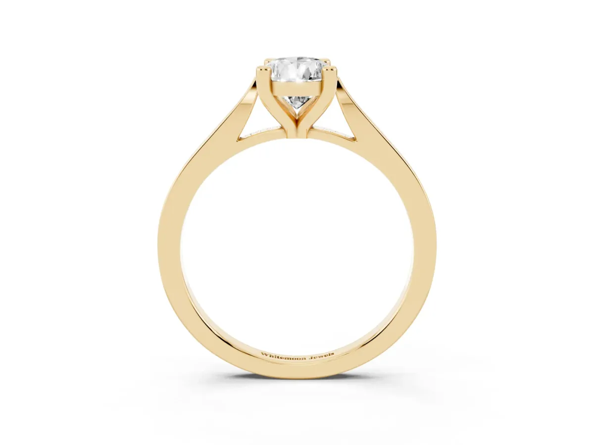 Pear Cut Solitaire Diamond Ring with Four-Prong Setting and Tapered Band Yellow gold