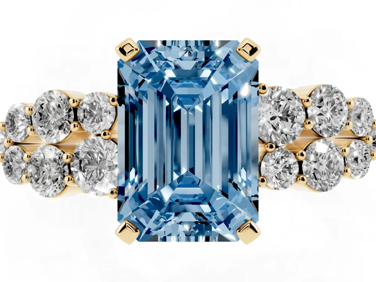 Fancy Blue Emerald Cut Cluster Diamond Engagement Ring with Pavé Band and Four-Prong Setting Yellow gold