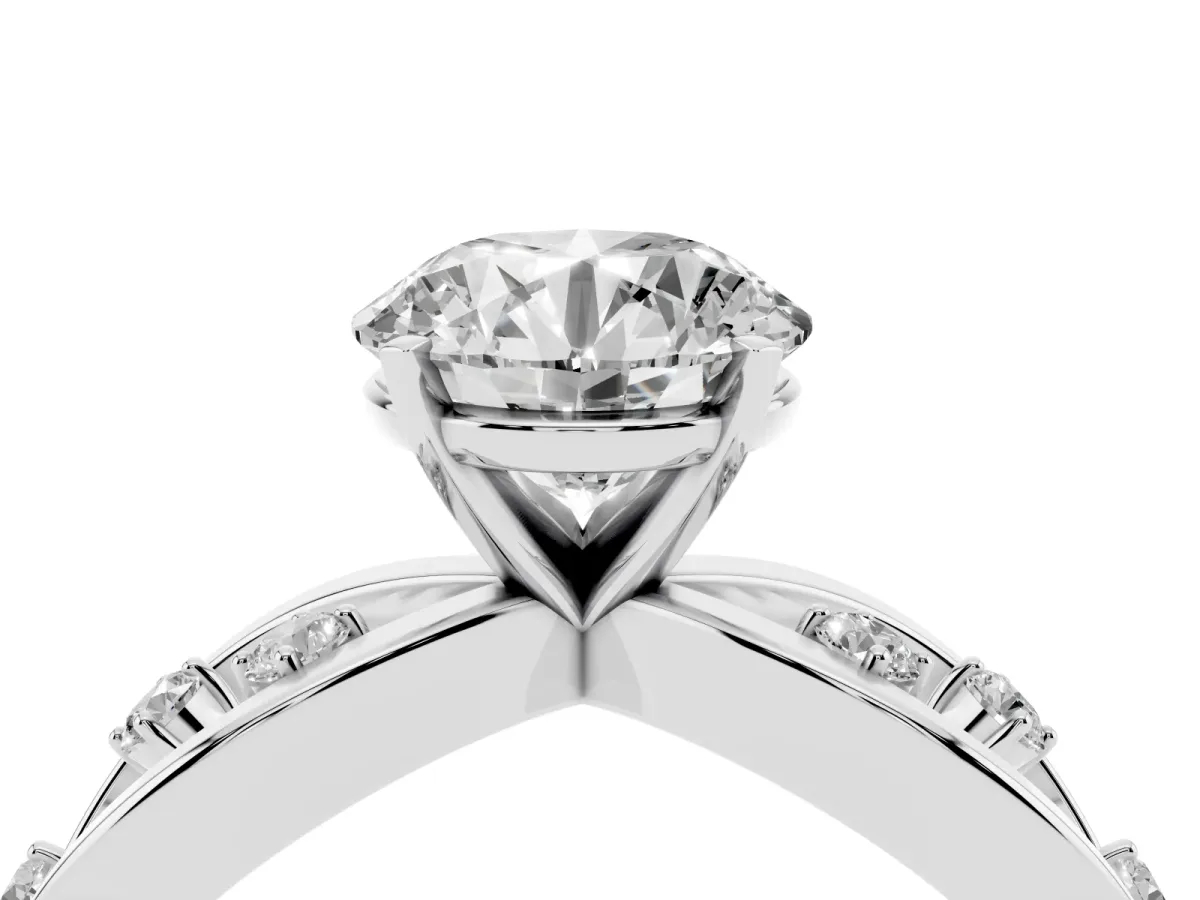 Round Cut Cut Solitaire Diamond with Side Stones on Criss-Cross Band and Four-Prong Setting Silver