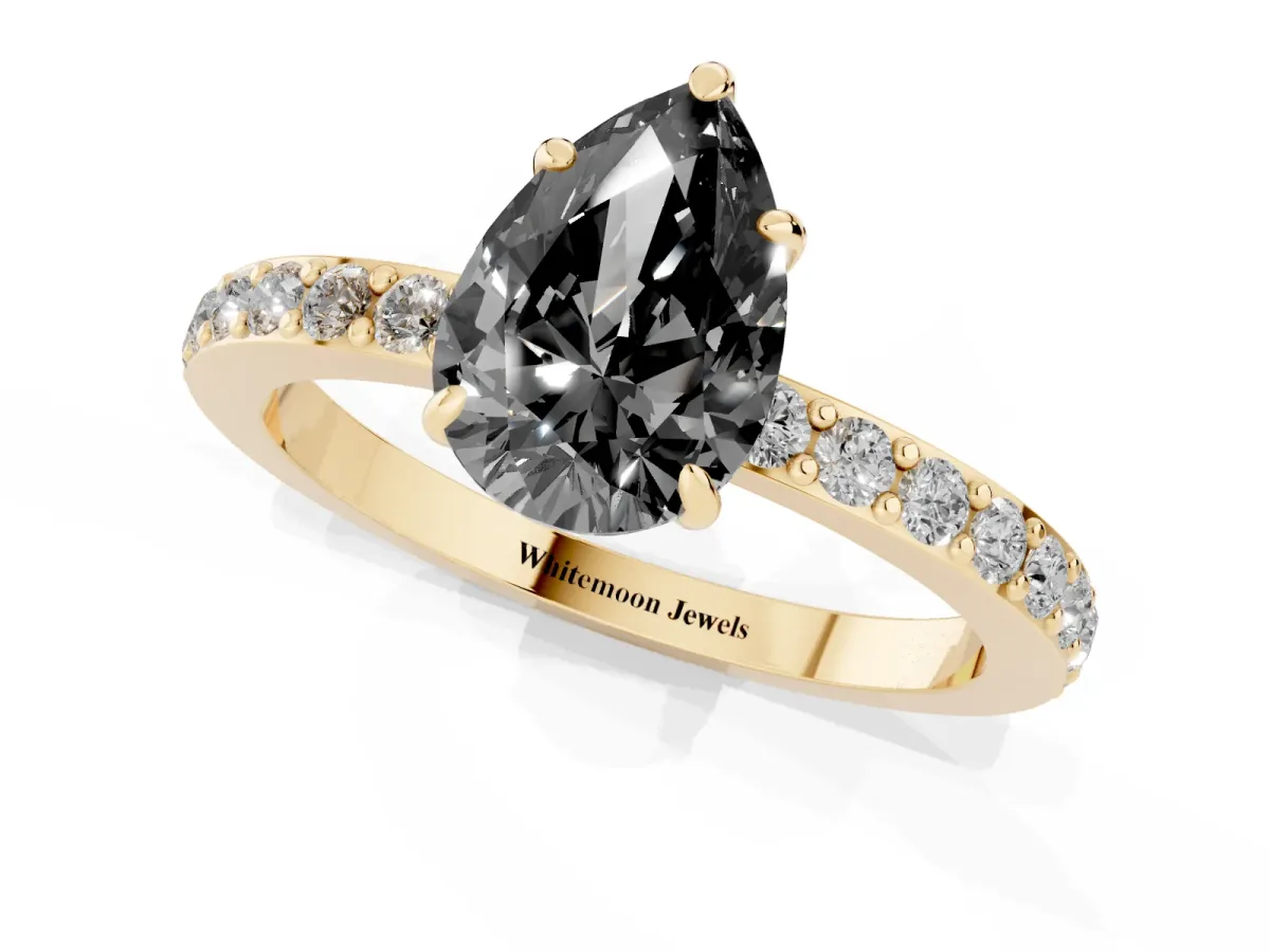 Fancy Black Pear Cut Diamond Pavé Engagement Ring with Round Accents and Prong Setting Yellow gold