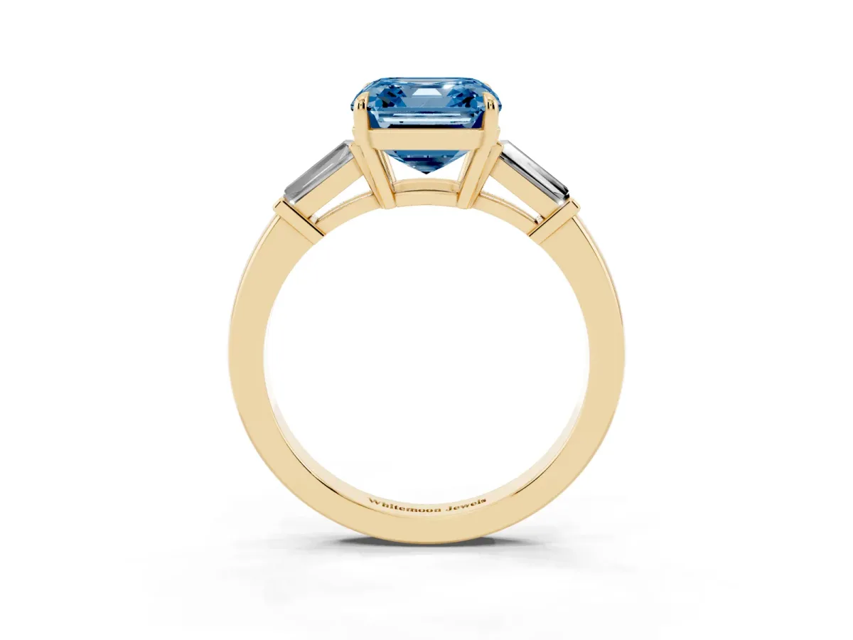 Fancy Blue Asscher Cut Diamond Three-Stone Ring with Tapered Baguette Side Stones and Prong Setting Yellow gold