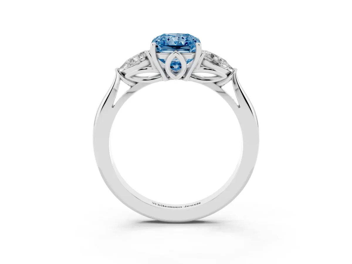 Fancy Blue Three-Stone Radiant Cut Diamond Ring with Pear Side Stones in Four-Prong Setting Platinum