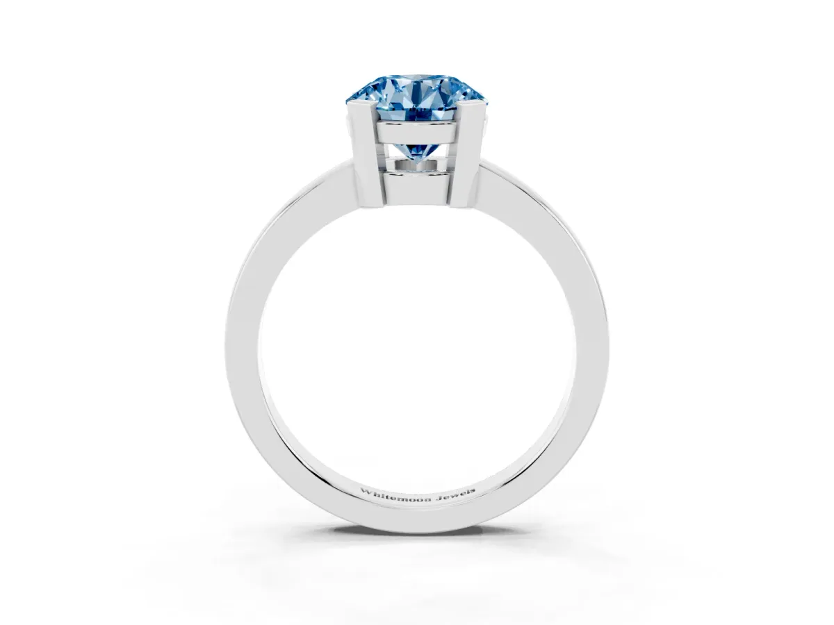 Fancy Blue Round Cut Cut Solitaire Ring with Four-Prong Setting and Classic Band Silver