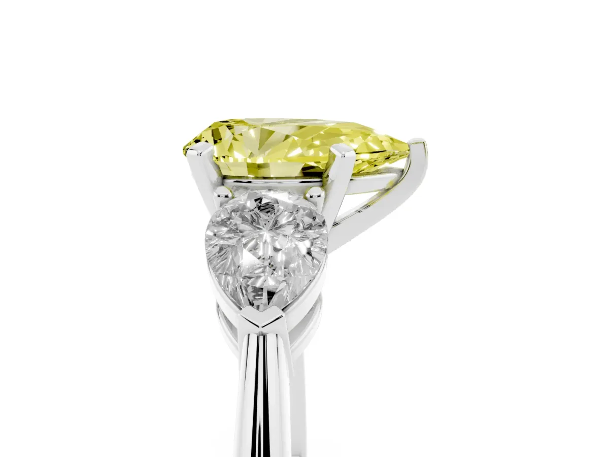 Fancy Yellow Three-Stone Pear Cut Diamond Ring with Pear Side Stones and Four-Prong Setting Silver