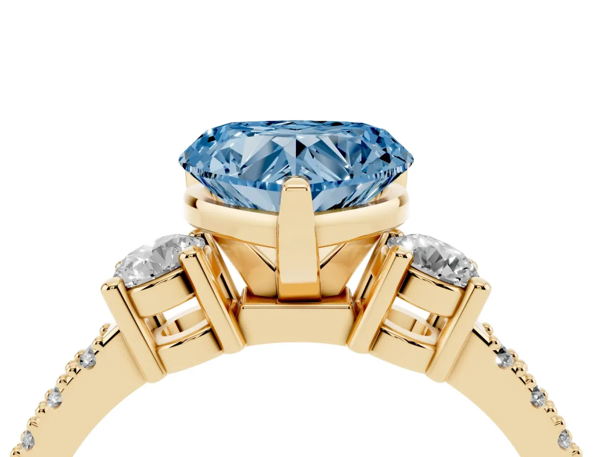 Fancy Blue Heart Cut Three-Stone Diamond Pavé Band with Prong Setting Yellow gold